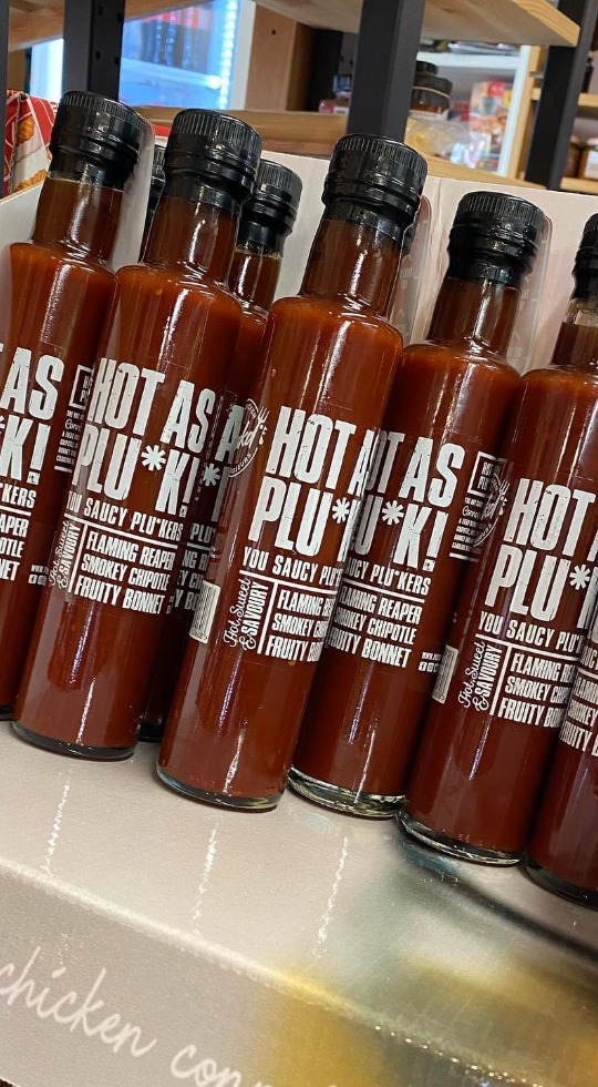 bottles of our hot as pluck sauce