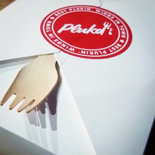 Plukd takeaway box and fork ready to be taken by a customer